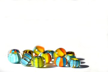 Beautiful colorful background made of lampwork beads isolated on white background. Suitable for text input.