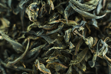 Close-up - collection of dried green tea leaves .Top view. Macro photo.