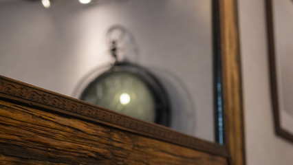 Wooden Frame and a time clock in a ceiling