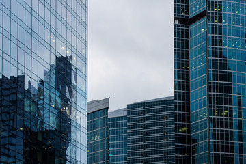 Obraz premium glass walls of skyscrapers with reflections in Moscow Russia