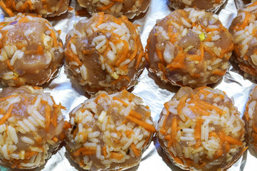 Chopped cutlets with onions and rice. Meatballs with rice.