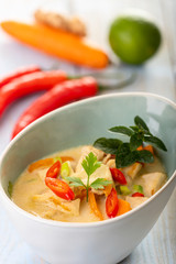 thai tom kha gai soup on wood