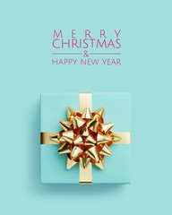 Merry Christmas and Happy New Year web banner. Blue gifts box and golden bow ribbon on blue background. 3d rendering illustration.