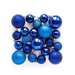 Classic blue New Year decoration. Abstract card on white background. Minimal flat lay and color of Year 2020 conceptconcept. Christmas balls composition. Winter holiday.