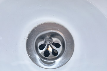 Water flowing down the drain