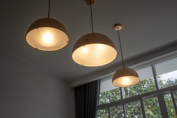 Suspended ceiling lamp sorted in a row, vintage style.
