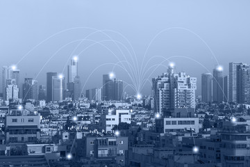 Communication network concept 5G smart city on blue background. Modern city wireless network connection concept.  Blue tone city scape and network connection concept.      