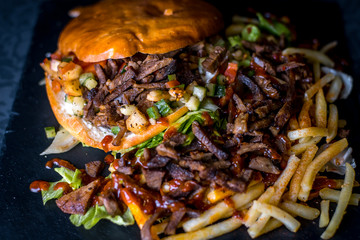 Delicious and juicy kebab with French fries