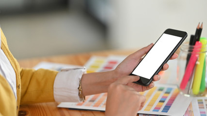 Close-up smartphone on creative woman hands.