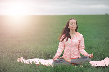 The girl in yoga on the outdoor