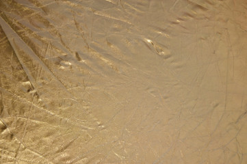 metal, stainless steel texture background with reflection. gold polished metal, steel texture. Gold foil background with light reflections. golden background. copy space. gold rumpled backdrop