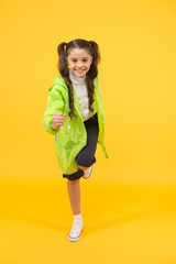 Schoolgirl wear raincoat. Kids raincoats with vibrant shapes unique designs. Schoolgirl wear water...