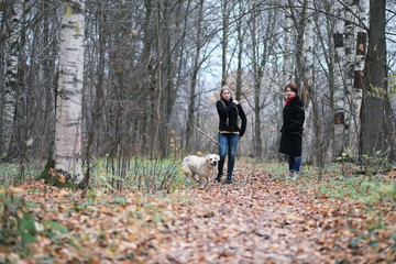 Fototapeta premium Young girl on a walk in the autumn
