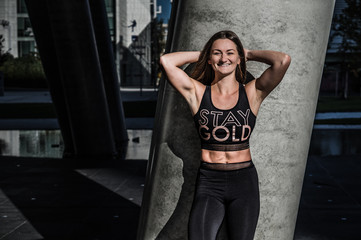 Fototapeta premium Beautiful girl - fitness trainer in black outfit
