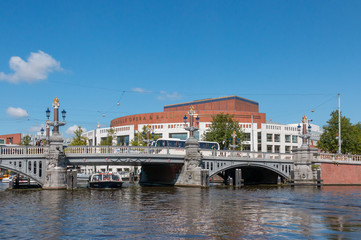Naklejka premium An old bridge over a canal in the city of Amsterdam