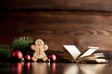 Bible book and gingerbread cookie on wooden table
