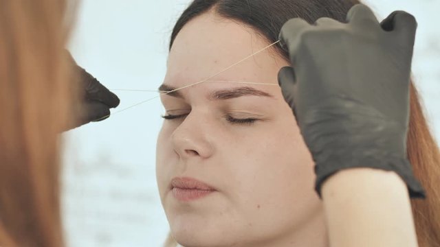 Create permanent eyebrow makeup. Create permanent eyebrow makeup. Thread depilation.