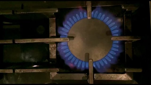 Close up burner turn on in slow motion. Flame burn step by step. 