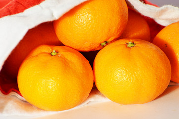 Tangerines in Santa Claus hat, new year composition,photo