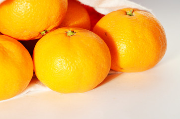 Tangerines in Santa Claus hat, new year composition,photo