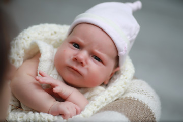 Baby newborn sleeping wrapped up in a blanket