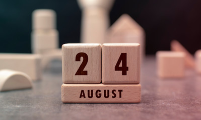 August 24 written with wooden blocks