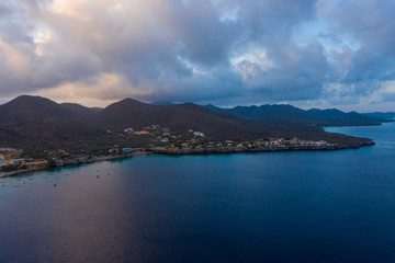 Fototapeta na wymiar Aerial sunrise view of coast of Curaçao in the Caribbean Sea with turquoise water and cliff around Westpunt