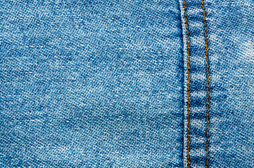 clothing items blue stonewashed faded jeans cotton fabric texture with seams, clasps, buttons and...