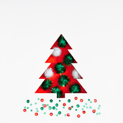 Christmas holiday composition. Xmas tree made of decorations on white background. Christmas, New Year, winter minimal concept. Flat lay, top view, copy space