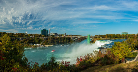 Niagara Falls is a group of three waterfalls at the southern end of Niagara Gorge, between the Canadian province of Ontario and the US state of New York