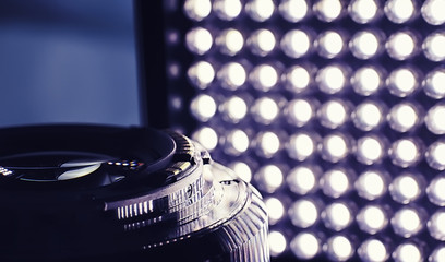 Equipment videographer and photographer. Lenses on the table against the background of bright...