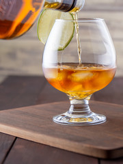 barman pouring whiskey in a bar