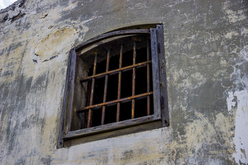 rusty iron-barred window