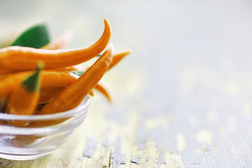 Hot orange pepper. Chilean pepper on a black.