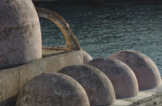 Details of old mosque in front of the sea. Ancient religious building in Venetian port of Chania, Crete.