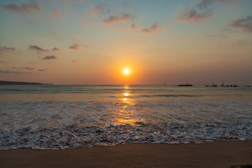 Fototapeta premium Beautiful sunset scenery at Jimbaran beach, Bali island, Indonesia.