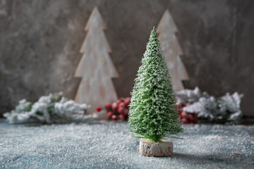Small christmas tree and snow