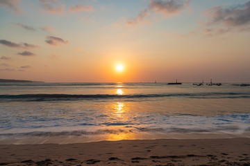 Naklejka na ściany i meble Beautiful sunset scenery at Jimbaran beach, Bali island, Indonesia.