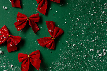 Christmas background with red bows and snow