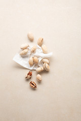 Fototapeta na wymiar Fresh pecan nuts on stone background on paper