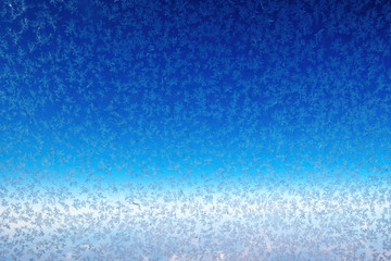 Frozen porthole glass and snowflakes on a blue background. Abstract backdrop