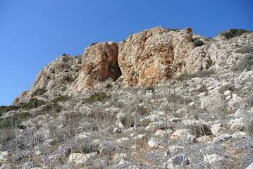 bottom up view of the mountain and cloudless summer sky