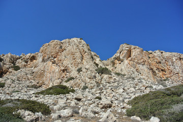bottom up view of the mountain and cloudless summer sky