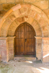 Fototapeta na wymiar Ancient romanesque wooden door