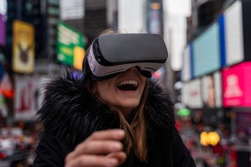 young woman using VR in the city of new york