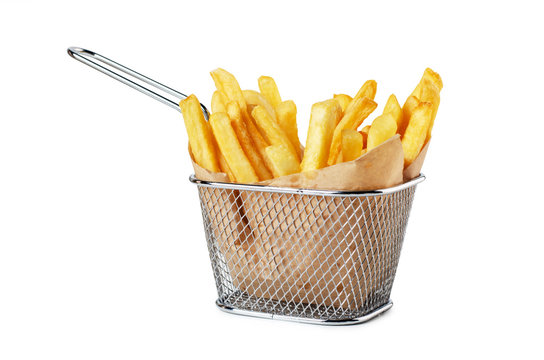 French fries in paper in metal wire basket isolated