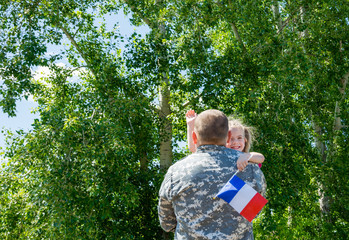 Happy reunion of soldier from France with family, daughter hug father