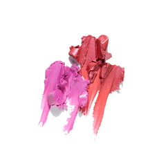 Creative concept photo of cosmetics swatches beauty products lipstick on white background.