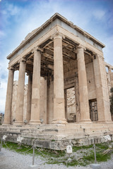 Naklejka premium Erechtheion or Erechtheum ancient Greek temple on the north side of the Acropolis of Athens in Greece dedicated to Athena and Poseidon.