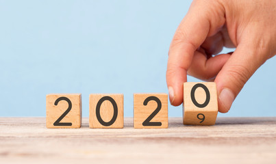  New Year's Concept.Hand Change Date From 2019 To 2020 On Wooden Cube Calendar.
